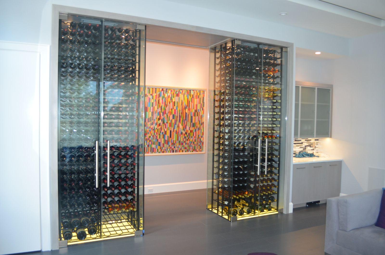 Custom wine room with glass enclosure and wooden racks